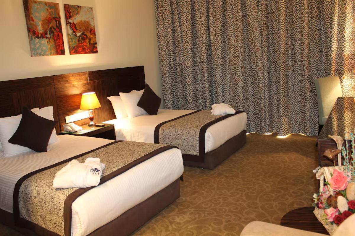 Tolip El Forsan Hotel Ismailia Exterior foto A room at the hotel